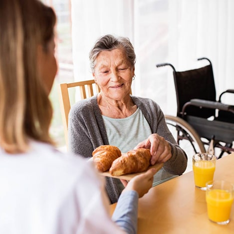 An older woman receiving care and support